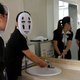 Illustration for article titled Chinese Employees Relieve Stress with Studio Ghibli Masks